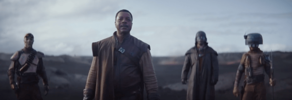 Greef Carga meeting the mandalorian with his thugs