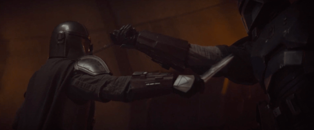 The Mandalorian fighting another one in the guild 