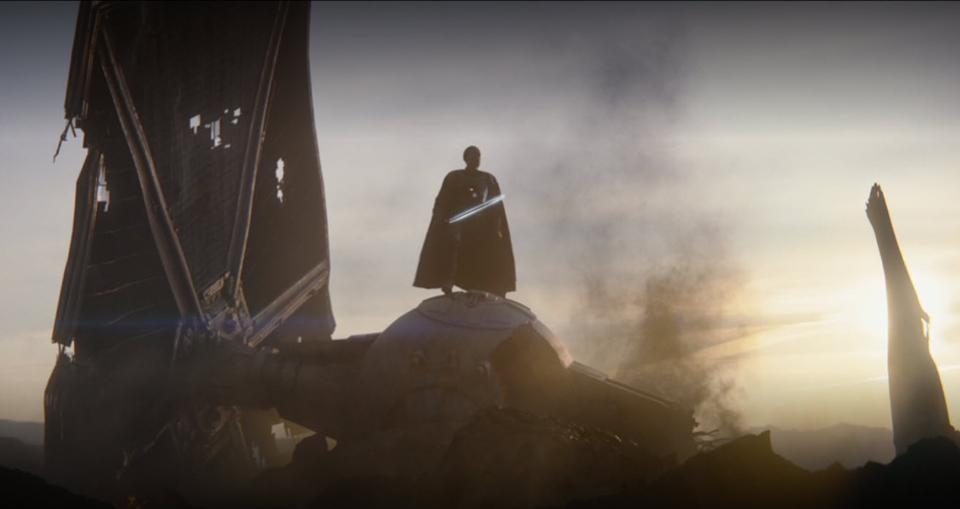 Gideon atop his destroyed tie fighter with his dark saber.