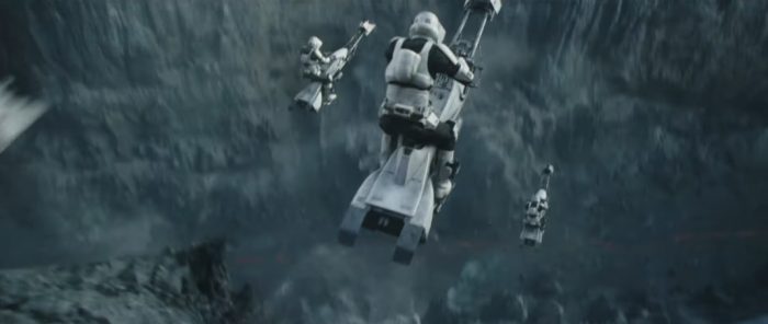 The gang steals a troop transport and these tanks are heavy-duty and can take a bit of a beating. Dune takes that sucker right off the cliff and they are gone. So they think, but some scout troopers hop on their bikes and speed after our heroes. 